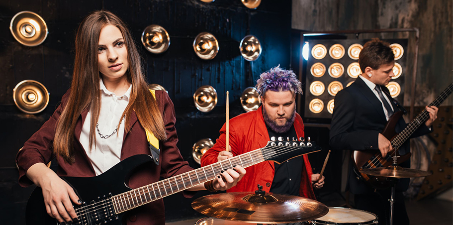 Musicians playing in various coloured suits